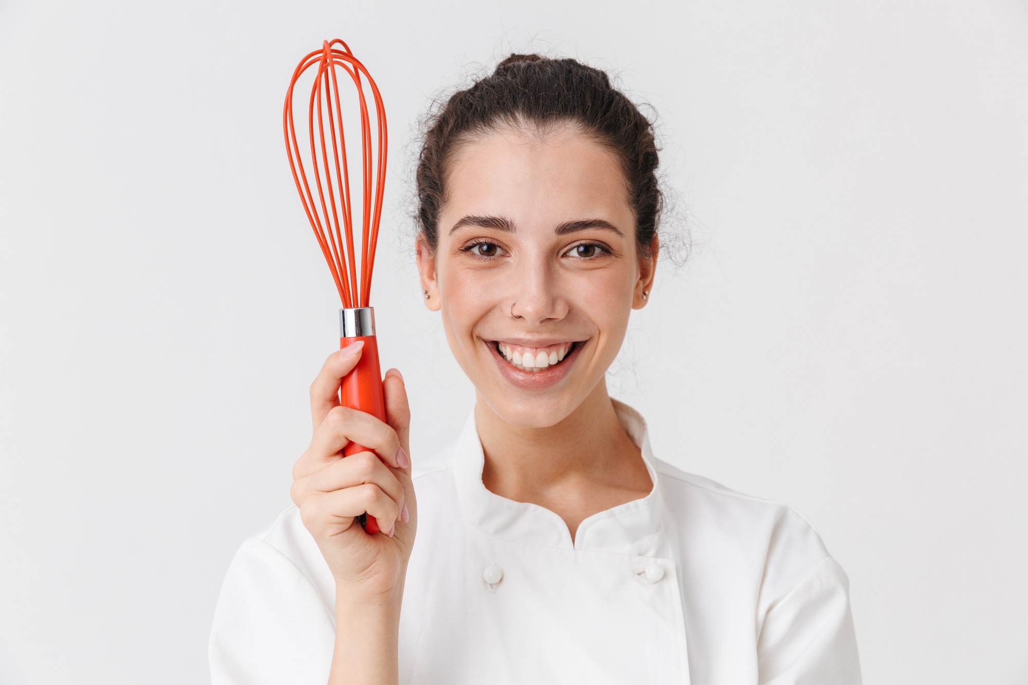 Instructor smiling with cooking tools